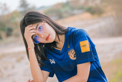 Portrait of beautiful young woman wearing sunglasses 