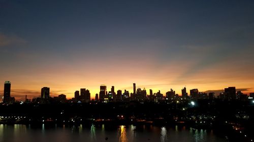 View of city at night during sunset