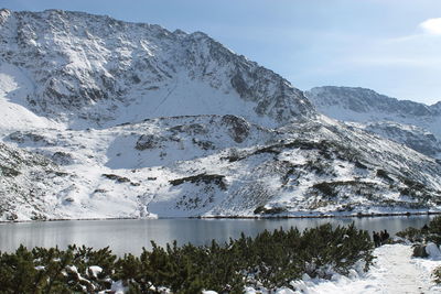 Scenic view of snowcapped mountains against sky