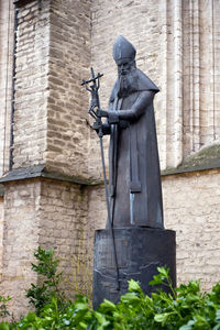 Statue against building