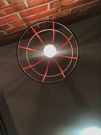 Low angle view of illuminated electric lamp