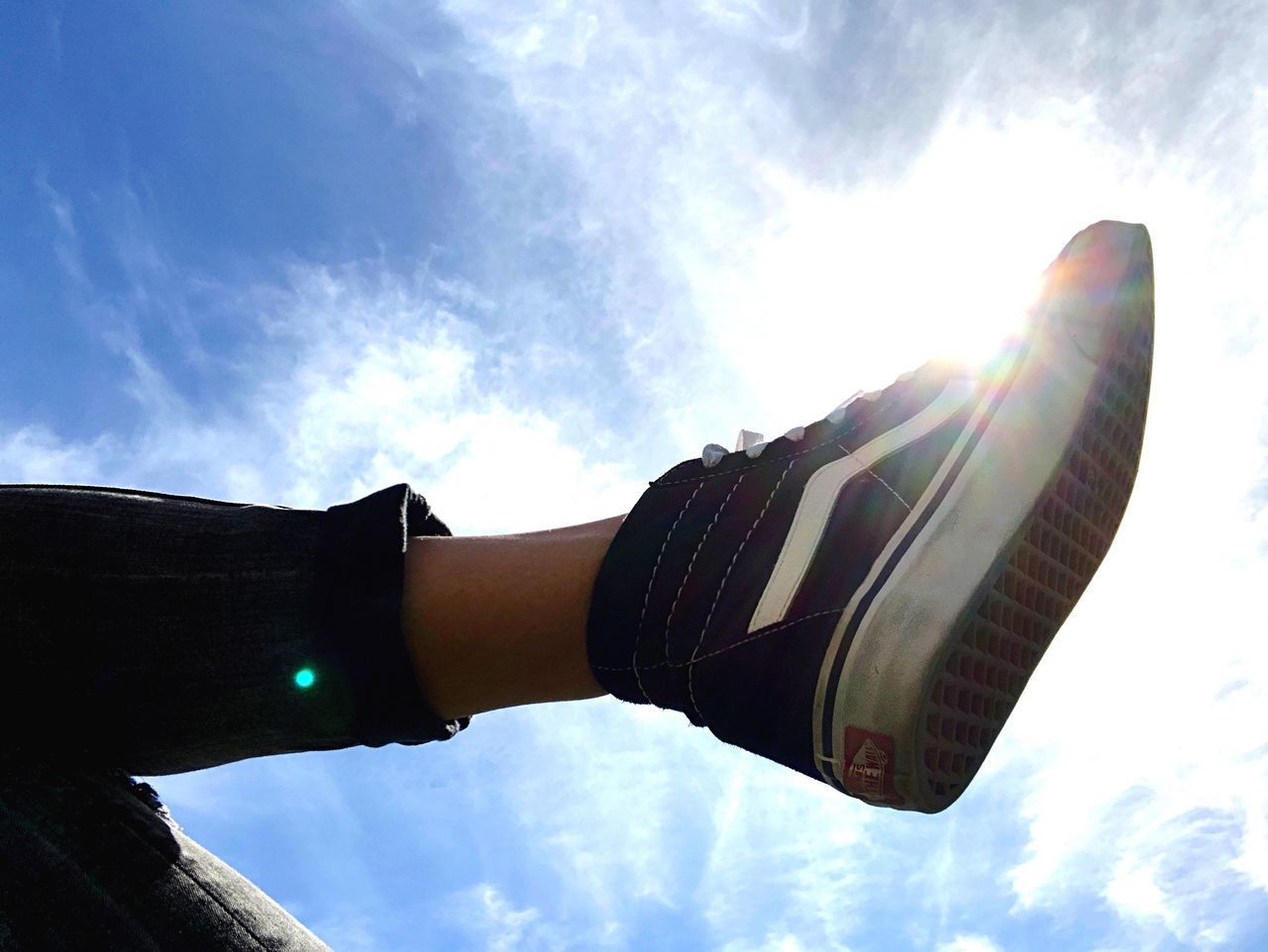 LOW ANGLE VIEW OF MAN AGAINST SKY