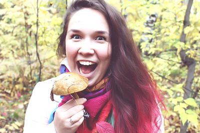 Portrait of happy woman eating ice cream