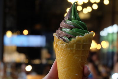 Close-up of hand holding ice cream