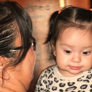 Close-up portrait of happy mother with baby