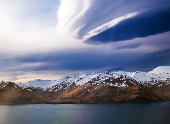 Scenic view of snowcapped mountains against sky