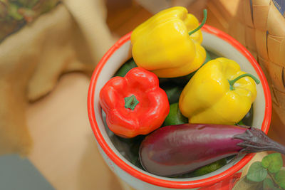 Cropped hand holding bell peppers