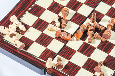 High angle view of chess pieces and board