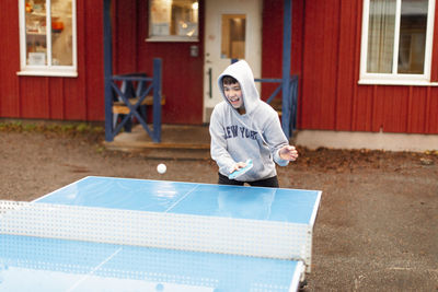 Boy playing table tennis