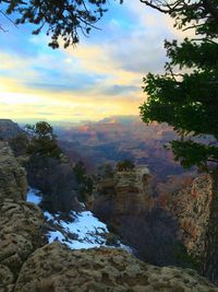 Scenic view of landscape against sky at sunset