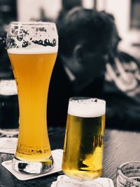 Close-up of beer glass on table