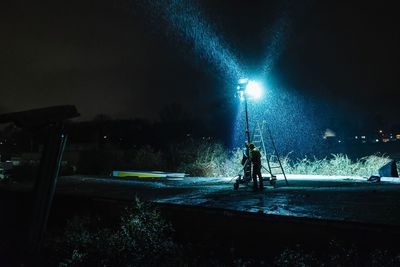 Illuminated street light at night