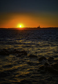 Scenic view of sea against sky during sunset