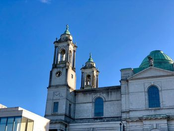 Low angle view of building against clear blue sky