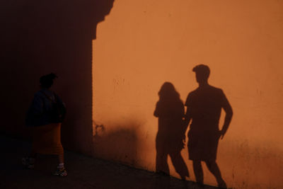 Shadow of a couple walking in the old city center of marrakesh