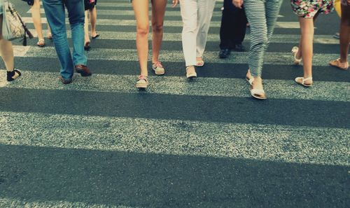 Low section of people crossing road