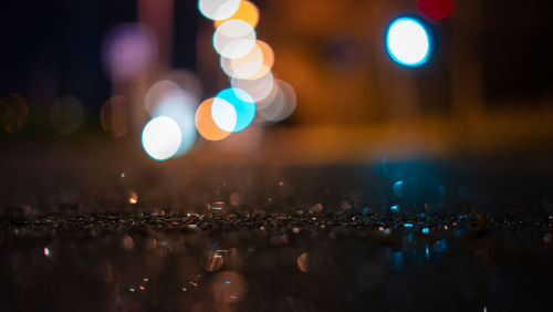 Defocused image of illuminated city at night