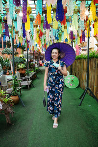 Rear view of woman with umbrella