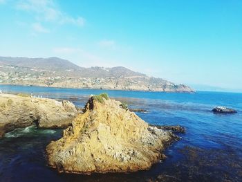 Scenic view of sea against blue sky