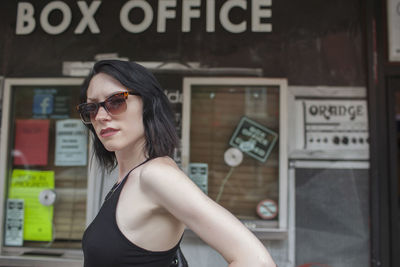 Portrait of young woman wearing sunglasses