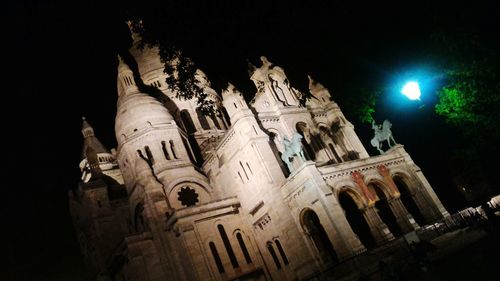 Low angle view of statue at night