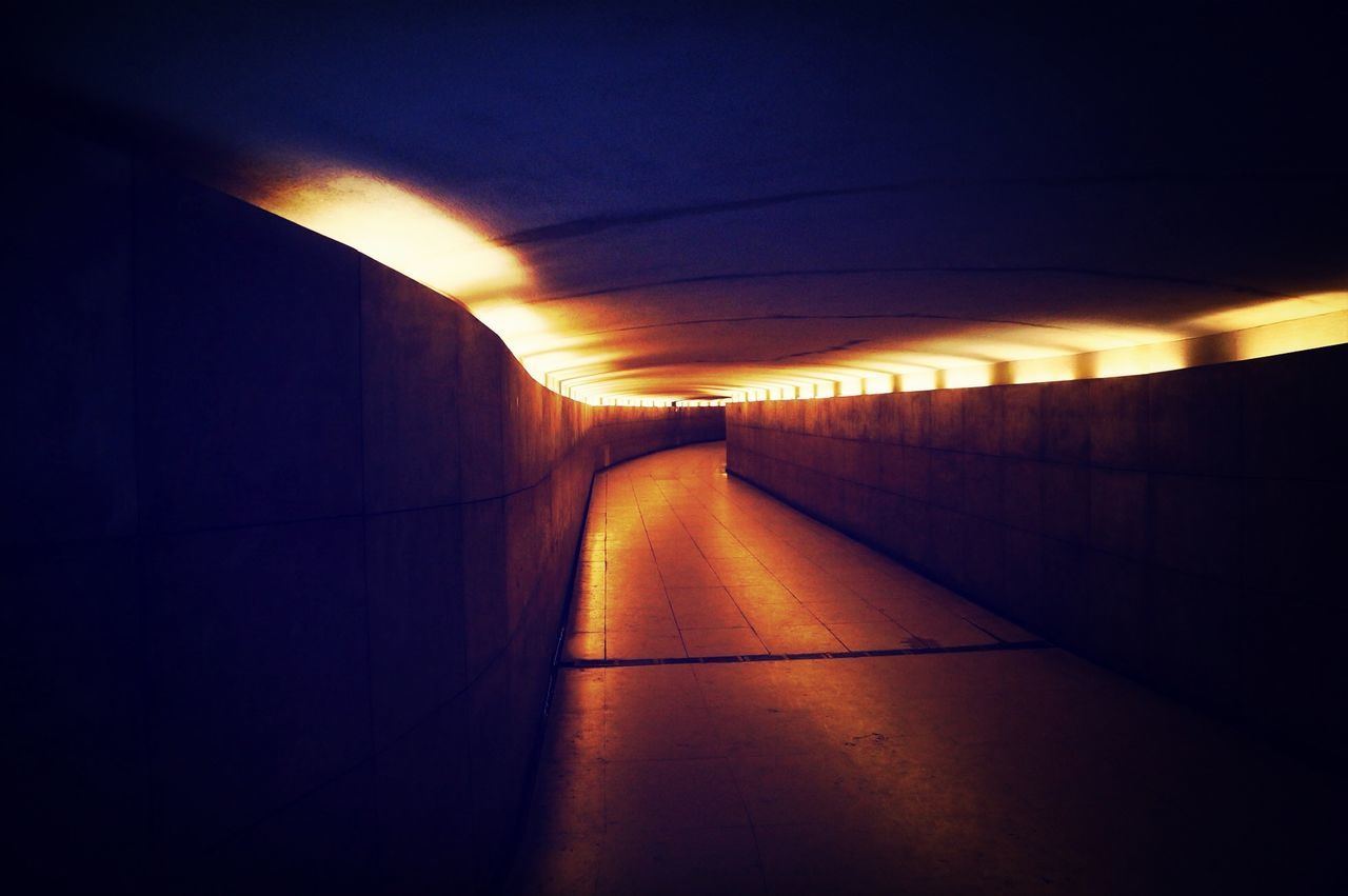 the way forward, indoors, diminishing perspective, illuminated, vanishing point, tunnel, built structure, architecture, narrow, long, lighting equipment, empty, transportation, sunlight, wall - building feature, corridor, no people, dark, light - natural phenomenon, ceiling