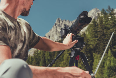 Midsection of man photographing