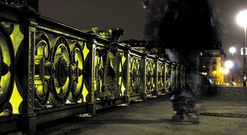 Low section of man on illuminated at night