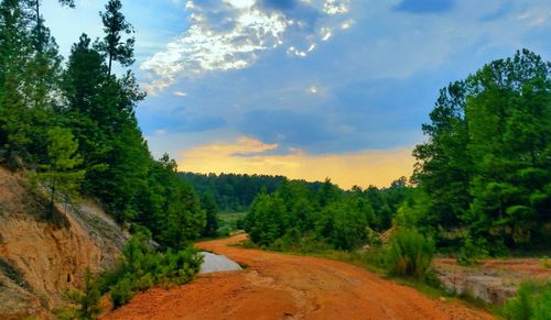 Scenic view of landscape against sky at sunset