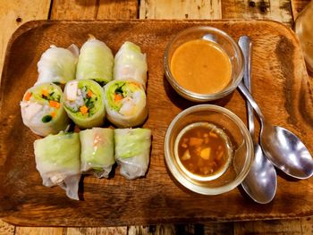 High angle view of spring rolls on table