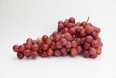 Close-up of grapes against white background