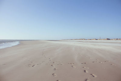 Scenic view of beach against clear sky