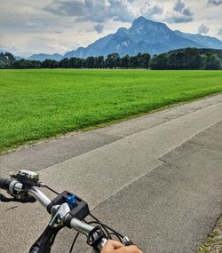 Man riding bicycle on road