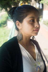 Portrait of a young woman looking away