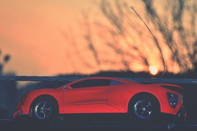 Car against sky during sunset