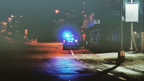 Car on illuminated city at night