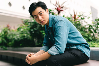 Portrait of young man looking away