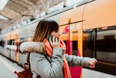 Rear view of woman in train