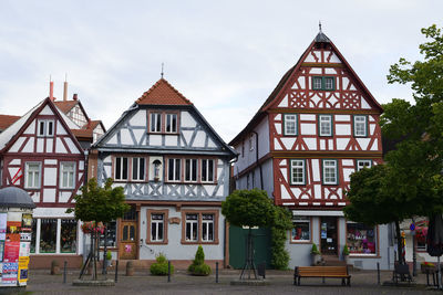 Building by street against sky