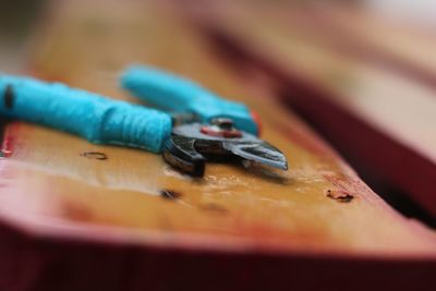 Close-up of rusty metal on table