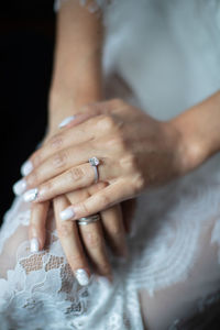 Cropped image of bride holding hands