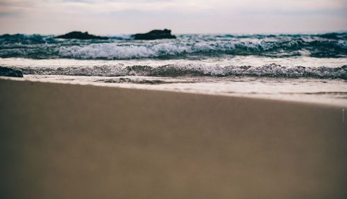 Scenic view of beach against sky