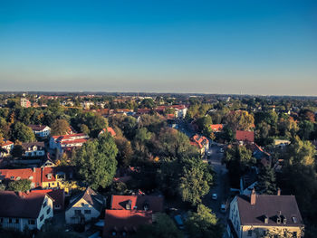 Aerial view of illuminated cityscape against clear sky at night