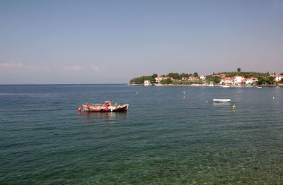 Boat in sea against sky