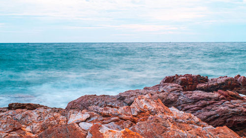 Sea ocean with smooth wave and rock landscape with blue sky. nature of seascape vacation time.