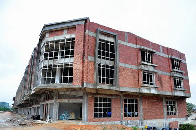 Low angle view of abandoned building against clear sky