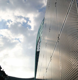 Low angle view of tower against cloudy sky