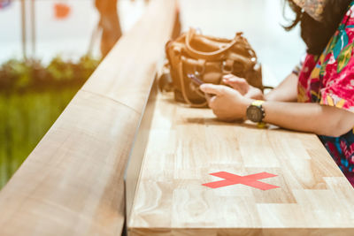 Close-up of woman hand holding table