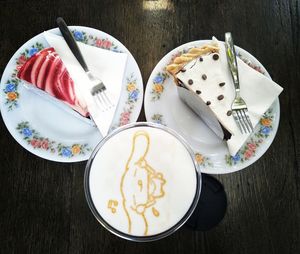 High angle view of dessert in plates on table