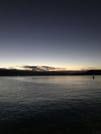 Scenic view of sea against clear sky during sunset